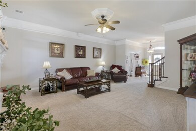 Living room view into eat in kitchen area.