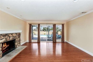 Living room with view to pool and patio