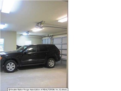 2 car garage with golf cart port. Storage room and