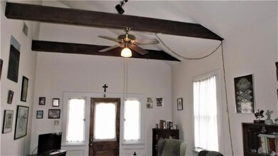 Vaulted ceilings with exposed wood beams really open up the living areas.