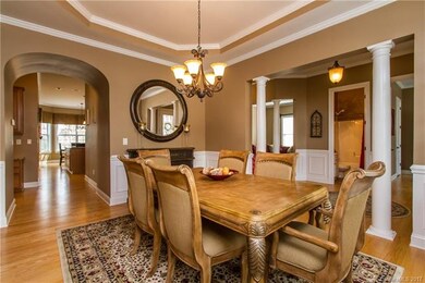 Formal Dining with arched walk-way leading to kitc