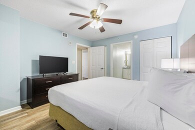 Bedroom featuring light hardwood / wood-style floo