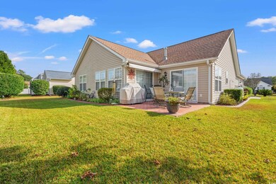 Back of house featuring a patio and a yard