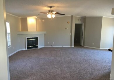 Great room with wood burning fireplace and crown m