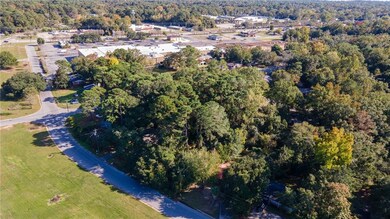 Aerial overview of property's location featuring a forest