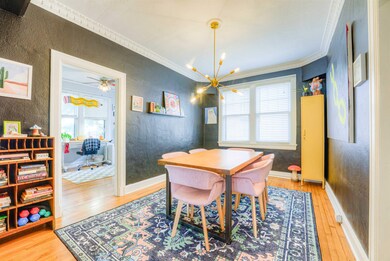 Dining space featuring a textured wall, wood finis