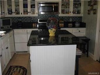 Large island with slab granite.