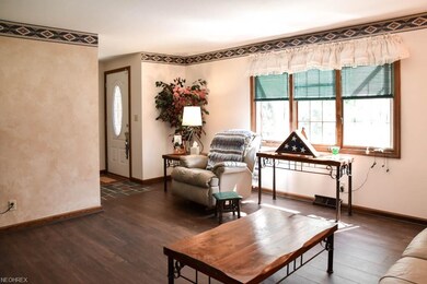 The living room has gorgeous laminate flooring and