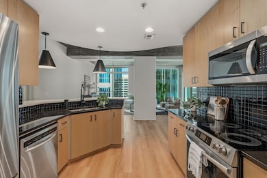 Kitchen featuring new lighting and countertops