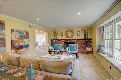 Living room view with opening to formal dining roo