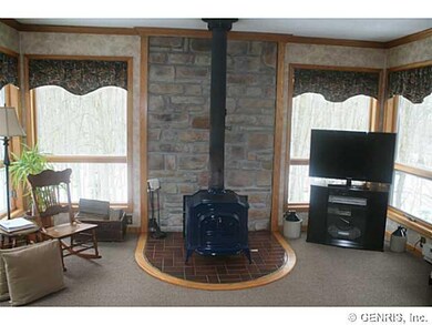 Family Room. A high end wood burning stove enhance