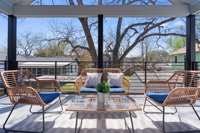View of patio with a balcony