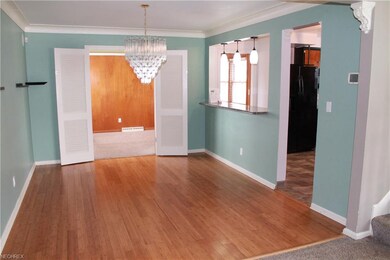 Dining room with beautiful bamboo flooring.