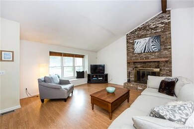 Gorgeous brick hearth and wood burning fireplace