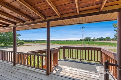 Deck featuring a view of rural / pastoral area and a lawn