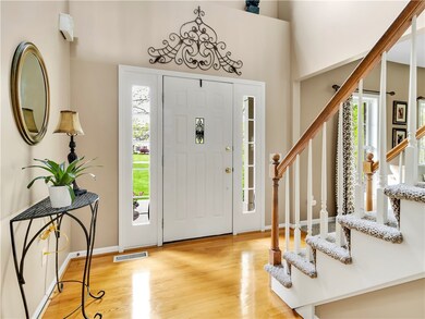 Open volume foyer with gleaming hardwood!