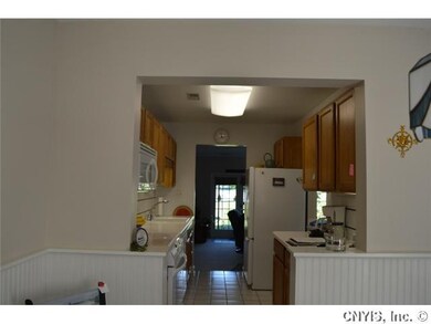Kitchen Note wainscoting and solid surface counter