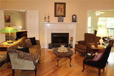 Living room has wood burning fireplace.