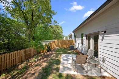 View of yard with a fenced backyard, a patio area,