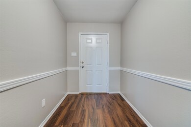 Freshly painted interior, new floors!  This is a view of the front entry.  A beautiful space for hanging family photos and artwork--your very own gallery.