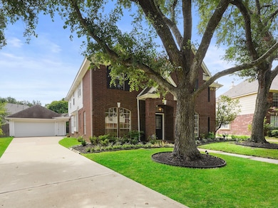  A stately brick exterior, classic black shutters,