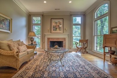 A cozy front sitting room with travertine surround