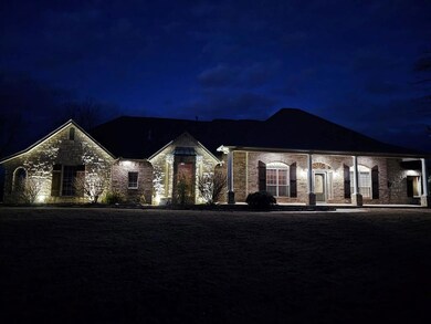 View of front of home night time view