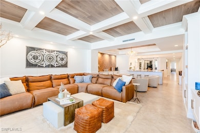 Living room featuring beamed and coffered ceiling