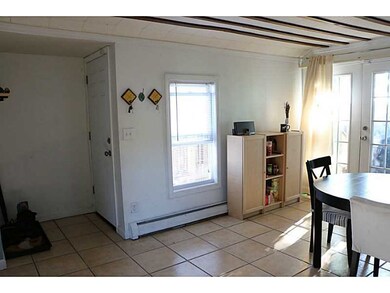 Dining Area. To the left are French doors leading