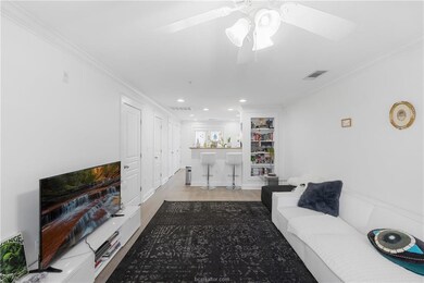 Living area with wood finished floors, ornamental