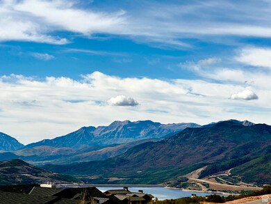 View of mountain background featuring a nearby body of water