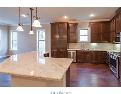 Kitchen. Granite Counter tops, a bar and a wine co