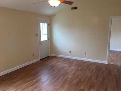 LIVING ROOM WITH VAULTED CEILING