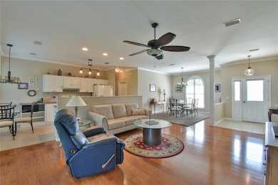 Kitchen is open and air and has a view of the living and dining rooms.