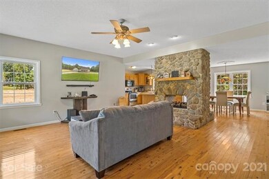 Beautiful See Through Stone Fireplace.  Open Floor Plan.