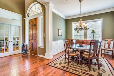 Entry opens up to formal dining room tastefully fi