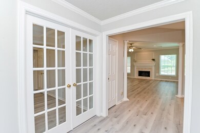 New flooring extends from entry into the family room as well