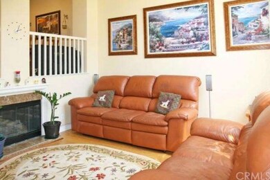 Living Room Features Beautiful Banisters, Hardwood