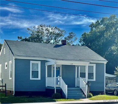 View of front of house with covered porch and a fr