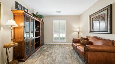 This home boasts so much space! This office area upon entry is currently functioning as a second living area.