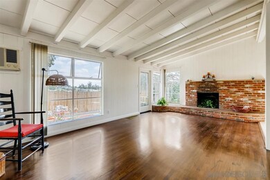 Polished wood floors, cozy fireplace, vaulted ceil