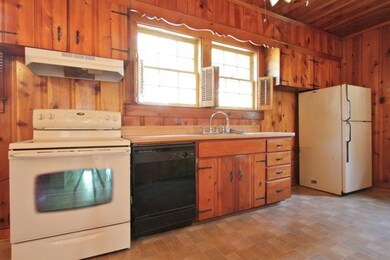 A spacious kitchen features direct access to the b