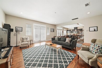 Staged.  Spacious living room with beautiful hardw