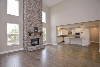 Your wowza Great Room that opens to your Chef's Kitchen & large Casual Dining Room. Very masterful L shape for your entertaining needs!