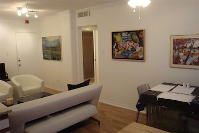Living room with ornamental molding, wood finishe