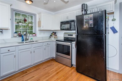 Kitchen with light hardwood / wood-style flooring,