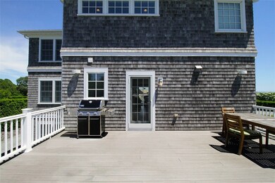 Back deck. Underneath is a large two car garage an