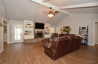 Large den with gas start fireplace.