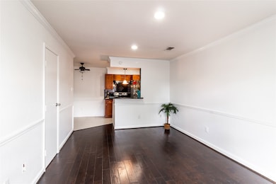 Huge living area with gleaming wood floors and rec