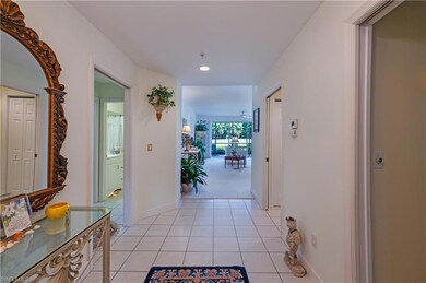 Corridor featuring light tile patterned floors and recessed lighting